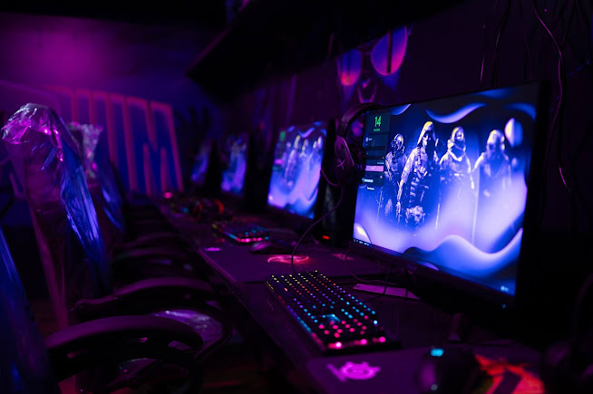 Gaming setups with RGB lighting at Arcadium